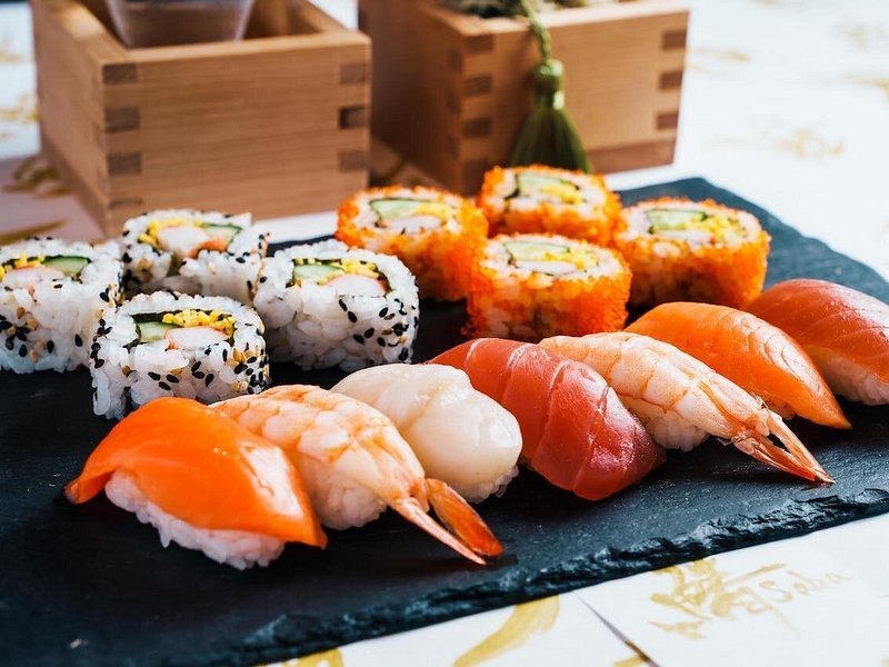 A platter of nigiri and maki sushi, cut and arranged for sharing