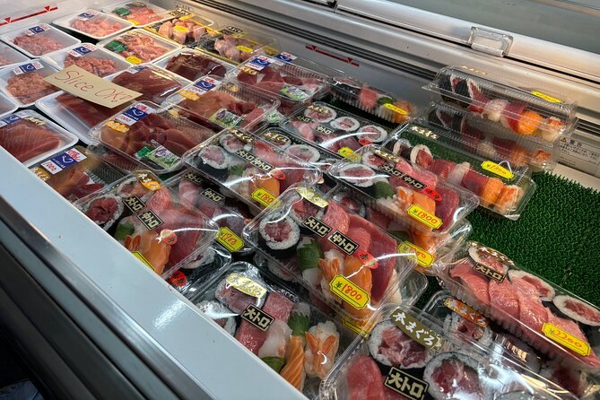 Trays of ready sushi and sashimi in a Tsukiji stall's chilled case
